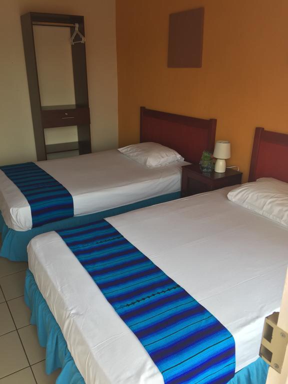 Hotel Villa Margarita Flores Quarto foto
