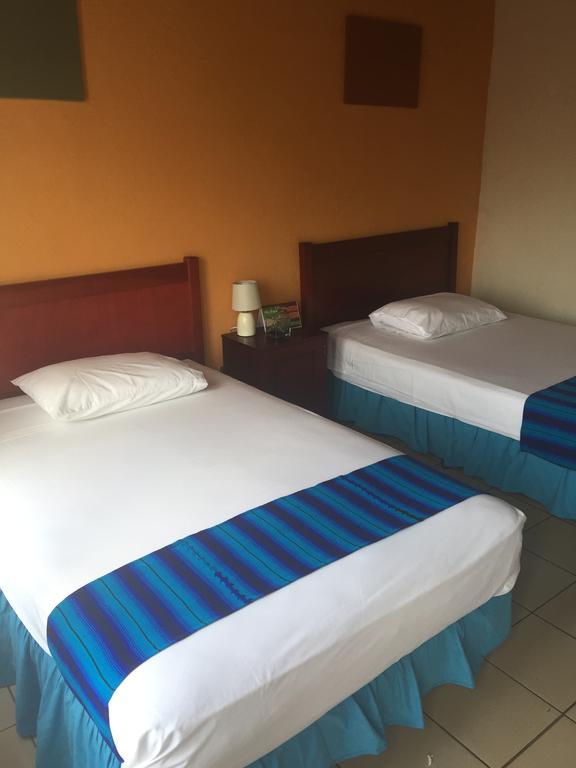 Hotel Villa Margarita Flores Quarto foto