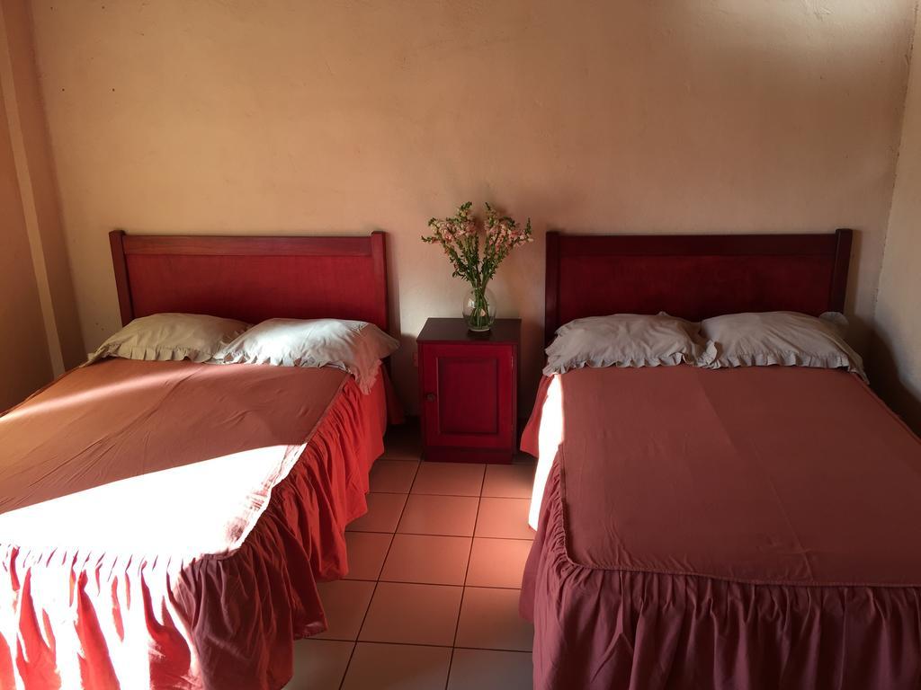 Hotel Villa Margarita Flores Quarto foto